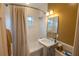 Bright, clean bathroom with a shower-tub combo and classic white tiling at 3624 Chelsea St, Orlando, FL 32803