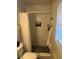 Tiled shower with shower curtain, built-in niche, and convenient fixtures at 3807 March Ave, Orlando, FL 32806