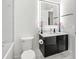 Sleek bathroom featuring a modern vanity, illuminated mirror, and minimalist design for a clean, contemporary look at 3845 S Stillwood Ln, Lake Mary, FL 32746