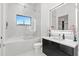 Elegant bathroom with a soaking tub, glass shower, and modern vanity, providing a relaxing and stylish space at 3845 S Stillwood Ln, Lake Mary, FL 32746