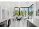 Bright dining area featuring floor-to-ceiling windows and modern chandelier at 3845 S Stillwood Ln, Lake Mary, FL 32746