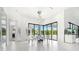 Bright dining area featuring floor-to-ceiling windows and modern chandelier at 3845 S Stillwood Ln, Lake Mary, FL 32746