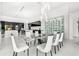 Bright dining area featuring floor-to-ceiling windows, modern chandelier, and wine storage at 3845 S Stillwood Ln, Lake Mary, FL 32746