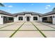 Eye-catching house with decorative driveway that features a modern design, black trim, and glass garage doors at 3845 S Stillwood Ln, Lake Mary, FL 32746