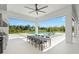 Outdoor dining space with a grill and kitchen, perfect for entertaining and enjoying al fresco meals with views of the pool at 3845 S Stillwood Ln, Lake Mary, FL 32746