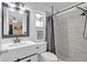 Modern bathroom featuring a sleek vanity, toilet and tiled shower with rainfall shower head at 388 Winnway St, Apopka, FL 32712