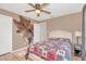 Bedroom boasting wall decor, neutral paint and a decorative ceiling fan at 388 Winnway St, Apopka, FL 32712