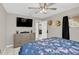 Bedroom boasting a calming color palette, ceiling fan and a doorway to other rooms in the house at 388 Winnway St, Apopka, FL 32712