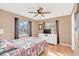 Bedroom with ample natural light, ceiling fan and a decorative bedspread at 388 Winnway St, Apopka, FL 32712