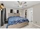 Comfortable bedroom featuring a ceiling fan, walk in closet, and easy access to an ensuite bathroom at 388 Winnway St, Apopka, FL 32712