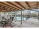 Inviting screened patio with dining set overlooking the sparkling swimming pool at 388 Winnway St, Apopka, FL 32712