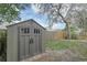 Well-maintained outdoor storage shed offers a secure and convenient solution for organizing gardening tools at 388 Winnway St, Apopka, FL 32712