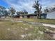 Single story home featuring a two car garage and a traditional style front yard at 3913 Rose Of Sharon Dr, Orlando, FL 32808