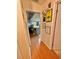 Hallway that shows entrance into a brightly lit kitchen area at 3913 Rose Of Sharon Dr, Orlando, FL 32808