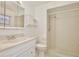 Well-lit bathroom featuring a single sink, a large mirror, and a shower at 4702 Kati Lynn Dr, Apopka, FL 32712