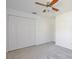 This bedroom has a ceiling fan and a large closet at 4702 Kati Lynn Dr, Apopka, FL 32712