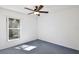 A bedroom with a ceiling fan and a view from the window at 4702 Kati Lynn Dr, Apopka, FL 32712