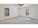 A bright bedroom with two windows offers ample natural light and a tranquil view at 4702 Kati Lynn Dr, Apopka, FL 32712