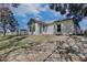 Exterior of the home showing the enclosed sunroom addition and backyard area at 4702 Kati Lynn Dr, Apopka, FL 32712