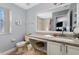 Well-lit bathroom featuring a neutral color scheme, a large vanity, and a shower-tub combo at 487 La Mirage St, Davenport, FL 33897