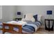 Bright bedroom featuring a blue and white striped bed and modern bedside tables at 487 La Mirage St, Davenport, FL 33897