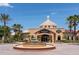 Elegant exterior of Regal Palms featuring a central fountain, lush landscaping, and a grand entrance at 487 La Mirage St, Davenport, FL 33897