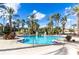 Inviting outdoor pool surrounded by lush tropical landscaping and lounge chairs for relaxing by the water at 487 La Mirage St, Davenport, FL 33897