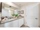 Bright bathroom featuring double granite vanity, white cabinets and decorative accents for a modern, stylish space at 512 Preston Cove Dr, St Cloud, FL 34771