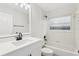 Bathroom featuring white vanity, tub with shower and matte black hardware at 5247 Secluded Oaks Dr, Orlando, FL 32812