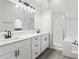 Modern bathroom featuring dual sinks, a large mirror, and a glass-enclosed shower at 5247 Secluded Oaks Dr, Orlando, FL 32812