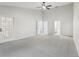 Spacious main bedroom includes ensuite bathroom, walk-in closet and french doors at 5247 Secluded Oaks Dr, Orlando, FL 32812