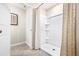 Bathroom featuring a standup shower with built-in shelving and neutral shower curtain at 532 Preston Cove Dr, St Cloud, FL 34771