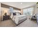 Comfortable main bedroom featuring a king-size bed, stylish decor, and lots of natural light from the window at 532 Preston Cove Dr, St Cloud, FL 34771