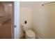 Toilet in half bath featuring tiled floors at 6855 Sperone St, Orlando, FL 32819