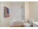 Clean bathroom with tile shower, white fixtures, and neutral color scheme at 6855 Sperone St, Orlando, FL 32819