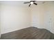 Bedroom featuring neutral paint, ceiling fan, and wood-look floors at 6855 Sperone St, Orlando, FL 32819