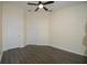 Bedroom with a fan, neutral walls, and two doors at 6855 Sperone St, Orlando, FL 32819