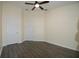 Bedroom featuring wood-look floors, neutral paint, and ceiling fan at 6855 Sperone St, Orlando, FL 32819