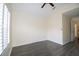 Bright bedroom with a fan and shuttered window at 6855 Sperone St, Orlando, FL 32819