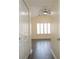 Hallway leading to a bedroom with wood floors at 6855 Sperone St, Orlando, FL 32819