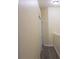 Hallway featuring laminate flooring, neutral walls, and closet for optimal storage solutions at 6855 Sperone St, Orlando, FL 32819