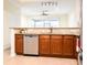 Spacious kitchen featuring stainless steel appliances, tile backsplash, and generous counter space at 6855 Sperone St, Orlando, FL 32819