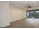 Open living room with sliding glass doors leading to a screened-in porch at 6855 Sperone St, Orlando, FL 32819