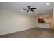 Spacious living room with wood flooring and an open layout to the kitchen at 6855 Sperone St, Orlando, FL 32819