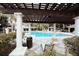 Community pool view with columns, pergola, and resort-style seating at 6855 Sperone St, Orlando, FL 32819