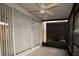 Enclosed patio featuring vertical blinds and a ceiling fan at 6855 Sperone St, Orlando, FL 32819