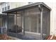 The screened in lanai features a ceiling fan and sliding doors to the interior at 6855 Sperone St, Orlando, FL 32819