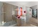 Bathroom showcasing a glass shower and soaking tub with built-in shelving and natural lighting at 7736 Brofield Ave, Windermere, FL 34786