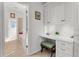 Hallway view of study nook featuring built in cabinets, desk and natural light at 7736 Brofield Ave, Windermere, FL 34786