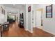 Open hallway with hardwood floors connecting multiple rooms and doorways, providing easy access at 7736 Brofield Ave, Windermere, FL 34786